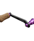 Premium Single Rocker Fishing Reel Handle With Rubber Cork Knob Carbon Fiber Core 70Mm Screw In Arm Length in purple with black grip.