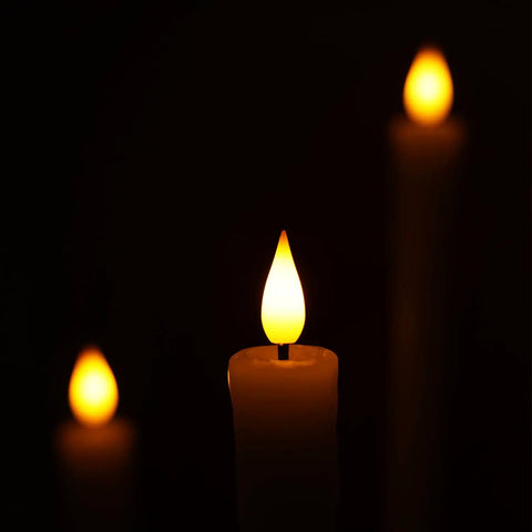 Flameless Taper Candles With Remote And Timer 6 Pack LED Battery Operated Flickering Ivory Candlesticks glowing in darkness