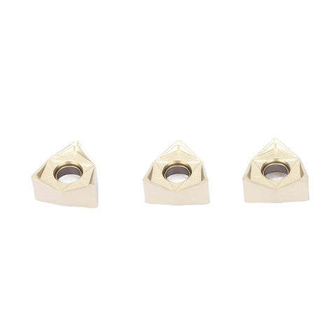 Three Baxnore gold-coated indexable carbide inserts for lathe turning front view