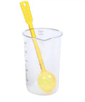 Clear measuring cup with yellow measuring spoon inside for Slick Vintage Balance Syphon Coffee Maker Set Featuring Heavy Duty Stainless Steel And Borosilicate Glass Vacuum Brewing System For A Dope Home Barista Morning Perk Ritual.