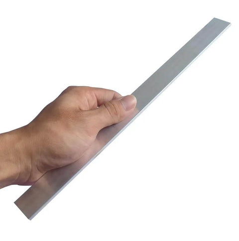 Hand holding 1/8 inch thick aluminum flat bar, 1 inch wide, 16 inch long, part of Two Pack 6061 T6511 for welding and fabrication projects.