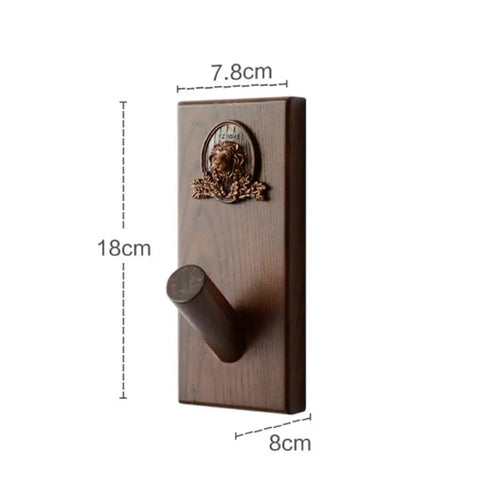 Slick Wall Mounted Coat Rack With Nifty Key Organizer Hook For Bathroom Entryway Closet Top Tier Heavy Duty Multi Hook Stand No Hassle Setup For Versatile Hats Purses And Keys, wooden design with a lion emblem.