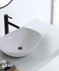 USZWBY Vessel Sinks Bathroom Vessel Sink Modern Simple Creative White Art Counter Basin Hotel Apartment Ceramic Wash Bathroom Bowl Sink close-up view with black faucet
