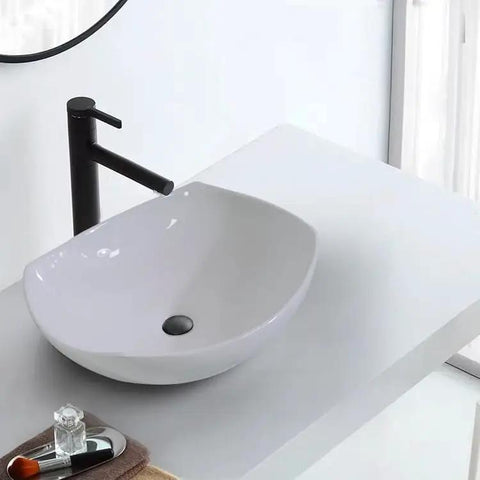 USZWBY Vessel Sinks Bathroom Vessel Sink Modern Simple Creative White Art Counter Basin Hotel Apartment Ceramic Wash Bathroom Bowl Sink close-up view with black faucet
