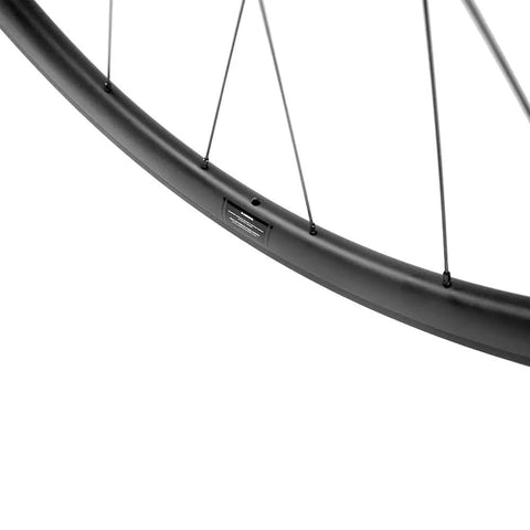 Close-up of 40mm deep carbon wheel rim with Sapim CX Ray spokes, part of Carbon Road Bike Wheelset 40mm Deep Tubeless Ready Rim 25mm Wide.