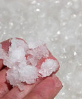 Granular ice in hand, showcasing the fluffy texture from No Sweat Commercial Ice Maker Cranking Out 1485 Lbs Of Granular Ice Daily With A Massive 1100 Pound Storage Bin And Water Filter Plus Scoop Built Right In For Bars And Restaurants.