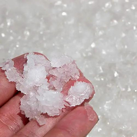 Granular ice in hand, showcasing the fluffy texture from No Sweat Commercial Ice Maker Cranking Out 1485 Lbs Of Granular Ice Daily With A Massive 1100 Pound Storage Bin And Water Filter Plus Scoop Built Right In For Bars And Restaurants.