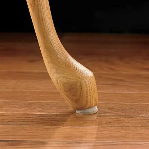 Wooden chair leg with 1 Inch Round Self Adhesive Felt Furniture Sliders For Hard Floors Leveling Pads To Stop Scratches Scuffs And Noise