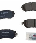 Front view of Bosch BC1539 QuietCast ceramic brake pads set; four pads with blue backing plates