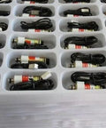 Tray of G130535 Push Pull Solenoid Electromagnet Linear Motor Valve 24V 2W High Torque 50g devices, organized in compartments.