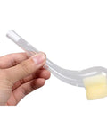 Hand holding a Six Pack Queen Catcher Pipe For Beekeeping, Plastic Queen Cages And Catchers, 15 Cm, with clear color and rounded sponge tip.