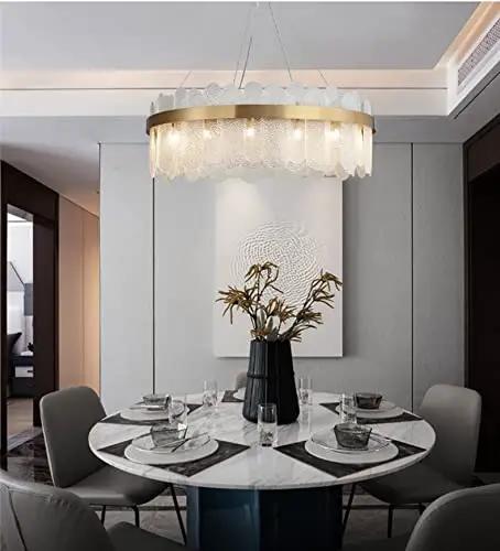 Sleek Gold Glass Pendant Light Adjustable Led Hanging Fixture With Cyan Crystal For Living Room Prime Pick Home Glow Up Solid Setup And Chic Everyday Vibes over a round dining table.