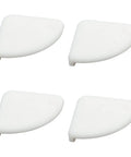 Four white silicone corner guards from a 36 pack, designed for furniture. Silicone Corner Guards for Furniture, 36 Pack Baby Safe Edge Bumpers.