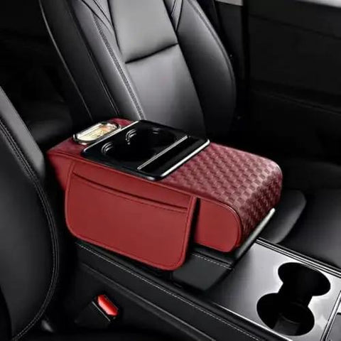 Waterproof Faux Leather Armrest Box Mat With Dual Cup Holders, Phone Slot, Tissues, Side Pockets, Elastic Straps, And Absorbent Cup Coaster, Quilted Elbow Rest For Long Drives, Keeps Your Ride Clean, Organized, And Comfy. red faux leather armrest mat in car seat with cup holder and phone slot
