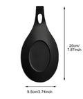 Black silicone spoon rest from Three Piece Silicone Spoon Rest Set For Stove Top And Kitchen Counter, heat resistant, 20cm x 9.5cm.