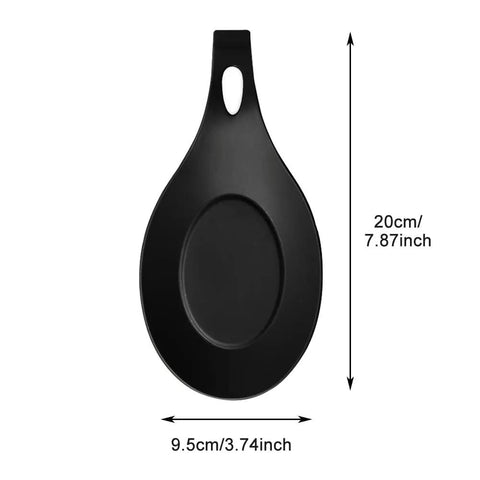 Black silicone spoon rest from Three Piece Silicone Spoon Rest Set For Stove Top And Kitchen Counter, heat resistant, 20cm x 9.5cm.