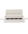 Front view of Mushroom Shaped Four Hole Paper Punch With Built In Ruler And Positioning Posts Metal Handheld Punch in compact white design.