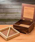 Wooden box with lid detached, showcasing Corner Key Doweling Jig for Decorative Mitered Joints With Molded Reference Lines and Drill Guides