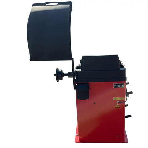 Heavy Duty Wheel Balancer Precise One Gram Accuracy Self Calibrating Garage Ready Tire Machine side view with digital controls