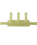 Vacuum hose connector manifold, yellow nylon, front view with multiple barbed outlets.
