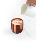 Renewed 6 Oz Smart Heated Coffee Mug With App Precision Temp Control And Solid Battery Life Keeps Your Favorite Brew Piping Hot And Ready For All Day Sipping Sessions with frothy coffee being poured.
