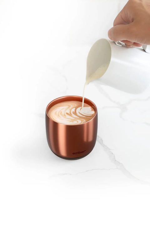 Renewed 6 Oz Smart Heated Coffee Mug With App Precision Temp Control And Solid Battery Life Keeps Your Favorite Brew Piping Hot And Ready For All Day Sipping Sessions with frothy coffee being poured.