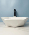 USZWBY Vessel Sinks Hexagonal Art Basin Sink Ceramic Wash Table Hotel Bathroom Single Bathroom Bowl Sink from side view on light background.