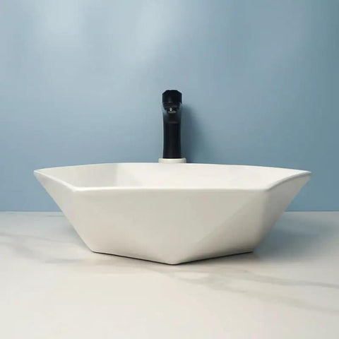 USZWBY Vessel Sinks Hexagonal Art Basin Sink Ceramic Wash Table Hotel Bathroom Single Bathroom Bowl Sink from side view on light background.