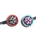Close-up of Pink 1207 Brushless RC Drone Motors 5000KV For 3 To 4S And 7500KV For 2 To 3S 4 Pack, showing two colorful motor designs.