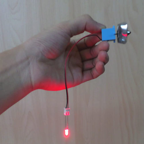 Compact Vertical Micro Wind Generator For AC Power Output 0.01 To 15V With 8 Silvered Plastic Blades handheld view