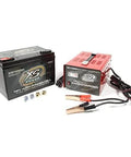 Front view of XS Power XP1000 black car battery and red IntelliCharger with clamps.