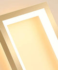 Close-up of Super Tight 16W Gold LED Wall Sconce With Dimmable Rectangle Frame and warm white glow.