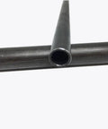 Close-up of 25mm Round Low Carbon Steel Pipe for Welding and Hydraulic Systems Seamless Workhorse Tubing with Phosphated Black Finish