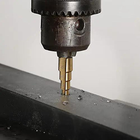 Pro Grade 3 Piece Step Drill Bit Set With Titanium Coated High Speed Steel drilling into metal, showcasing two-flute design.
