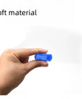 Person holding a blue Colorful Luminous Wheel Hub Screw Cap, showcasing its soft material and flexibility.