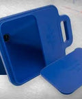 Top Shelf 2 Gallon Hopper Gun Paint Sprayer Featuring Slick Adjustable Nozzle And Quick 45 Degree Angle Adapter Soft Grip Trigger Smooth Flat Texturing For Drywall And Interior Floors removable and sealable hopper top in blue with user pouring paint.