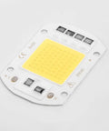 LED COB Chip Floodlight Bulb 20W 30W 50W 220V Input High COB chip lighting component with yellow surface on a white background.