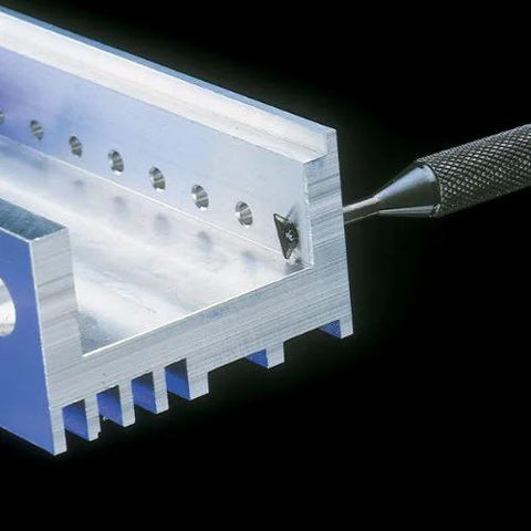Noga RC2200 large reversible deburring tool holder in aluminum block with mounted blade