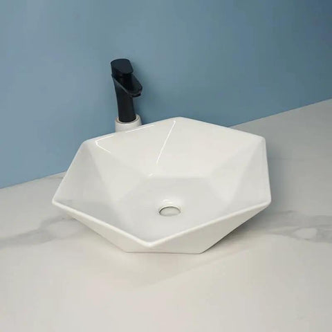 USZWBY Vessel Sinks Hexagonal Art Basin Sink Ceramic Wash Table Hotel Bathroom Single Bathroom Bowl Sink on a white counter.