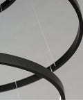 Close-up of Modern Black Aluminum Pendant Light For Kitchen Island Dining Room With Adjustable Drop Cord Sleek Groove Design.