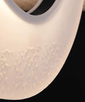 Close-up view of the textured surface of the Large Chinese Style Wrought Iron And Solid Wood Ceiling Pendant Chandelier.
