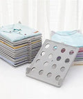 Slick Setup Folding Clothes Organizer Set For Quick T Shirt Folder Board With Stackable Clothing Dividers Stress Free Drawer Closet Storage For Zero Wrinkles And Easy Laundry, featuring folded shirts with organizer board.