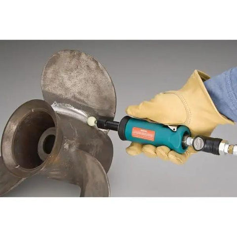 Person using Badass.5 Hp Straight Line Die Grinder Pumping 24000 Rpm on metal propeller for polishing.