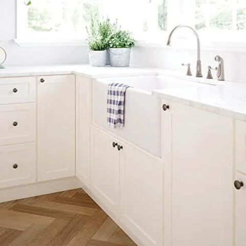 Installed view of Fulton Soft Iron Round Cabinet Knobs One And Three Sixteenth Inch Easy Install Durable Hardware on kitchen cabinets