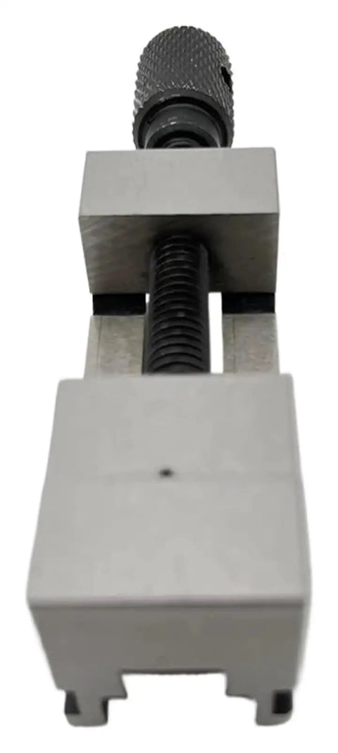 Premium Steel Precision Milling Machine Vise For Inspection And Grinding Operations Featuring Constant Clamping Stability To Reduce Part Processing Time With High Efficiency 25mm Jaw Capacity At.005mm Accuracy, close-up of steel jaws and screw.