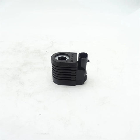 KV23085 solenoid valve coil, black plastic housing with electrical connector, front view