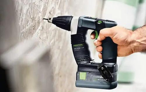 Hand using Hardcore No Fuss Cordless Construction Screwdriver With Brushless Motor Tech for driving screws into a wall.