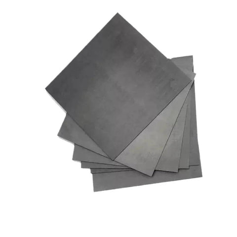 Stack of self lubricating graphite sheets for easy machining and durable performance, 100 by 100 by 8 millimeter graphite block plate for 3D printing.