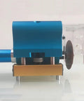 Heavy duty pneumatic dotting machine in blue and gold for carton die cutting and box making close-up view.