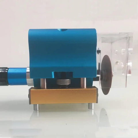 Heavy duty pneumatic dotting machine in blue and gold for carton die cutting and box making close-up view.
